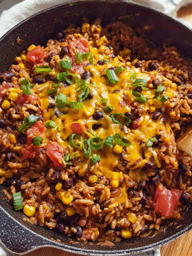 One-pot lentil and rice skillet with cheese and green onions