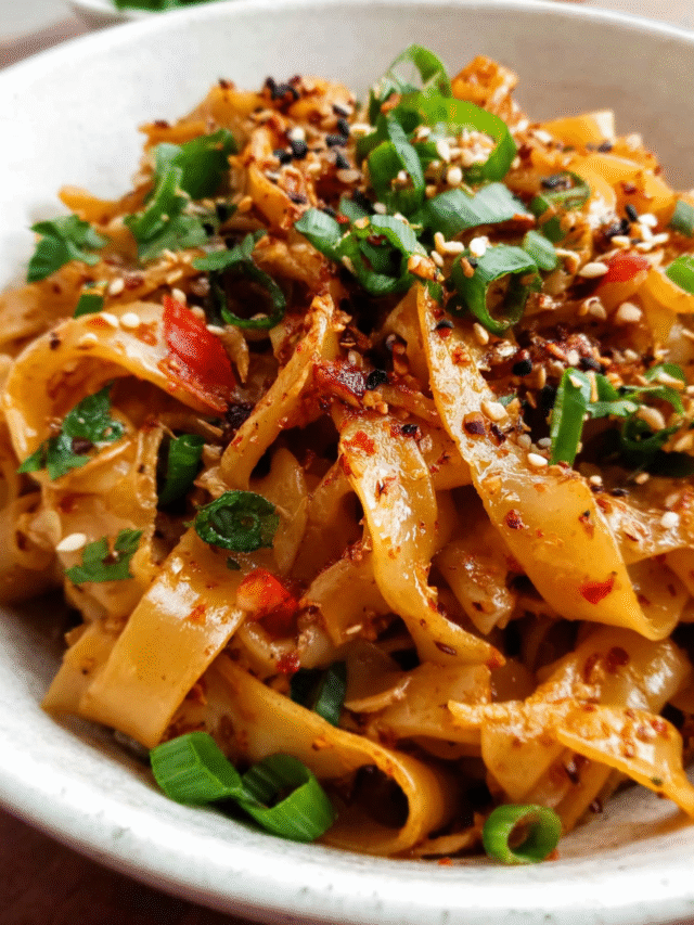 bowl of spicy chili garlic noodles with green onions