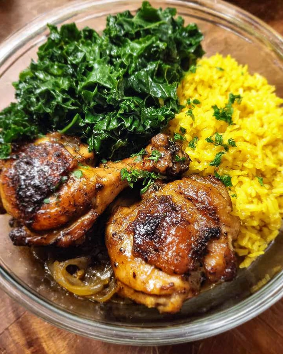 Chicken adobo meal prep bowl with yellow jasmine rice and garlic kale