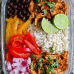 Chicken burrito bowls for meal prep with rice, beans, and toppings
