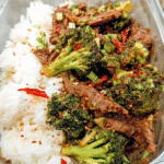 Meal Prep Beef and Broccoli in glass container with rice