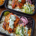 Meal Prep Chipotle Chicken Burrito in glass container with rice and beans