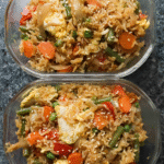 Meal Prep Egg Fried Rice with vegetables and sesame seeds in meal prep containers
