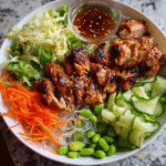 Meal Prep Miso Chicken Noodle Bowl with veggies and sauce
