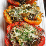 Meal Prep Philly Stuffed Bell Pepper filled with beef, mushrooms, and provolone cheese