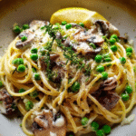 Mushroom pasta with peas served with ricotta