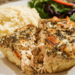 Baked pesto ranch chicken freezer meal with golden crust in pie plate