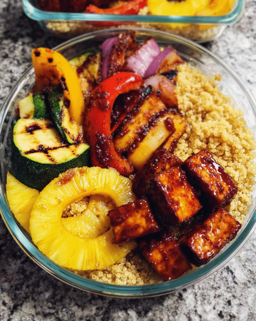 Pineapple BBQ tofu meal prep bowls with grilled vegetables and quinoa