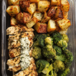 Ranch chicken meal prep in containers with potatoes and broccoli