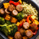 Roasted sausage, veggies and quinoa meal-prep in glass containers