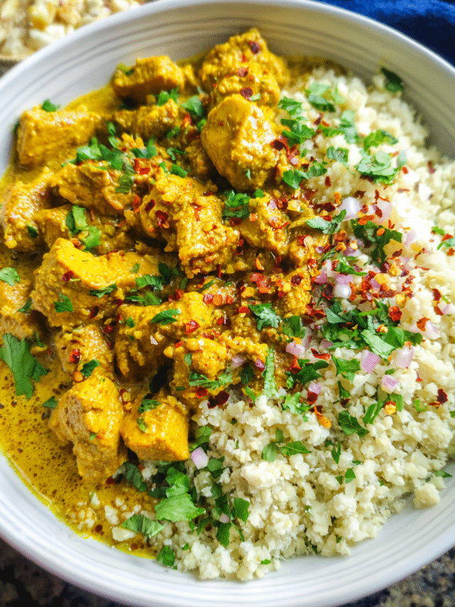 Creamy coconut curry chicken served over cauliflower rice