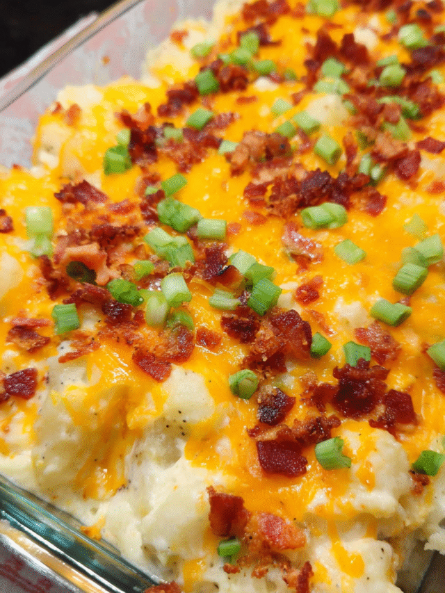 Loaded baked potato casserole with cheddar cheese and green onions