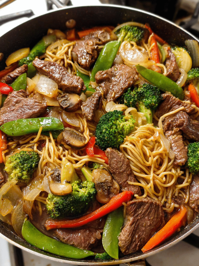 Meal Prep Beef and Veggie Stir-Fry Noodles in a skillet with colorful vegetables and noodles