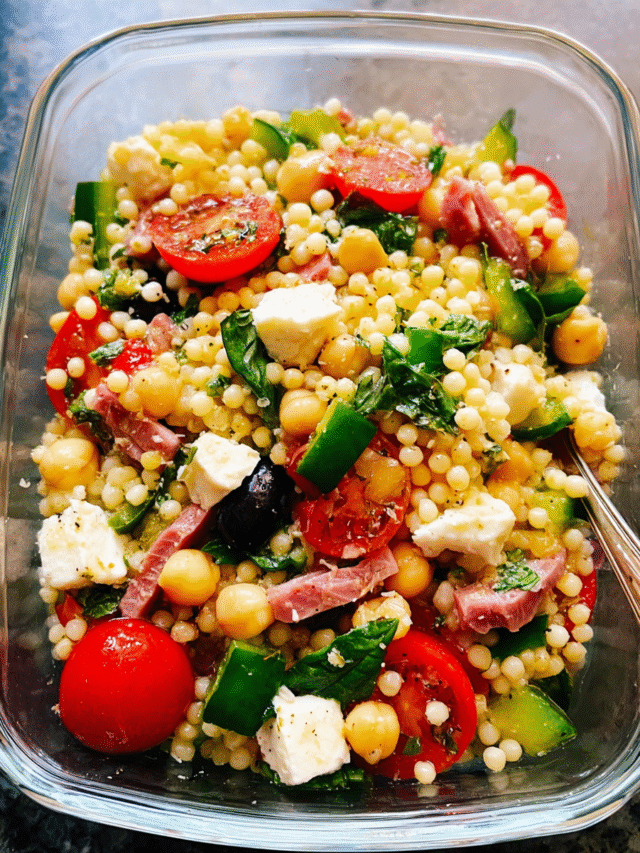 Meal Prep Italian Couscous Salad with vegetables and mozzarella in meal containers