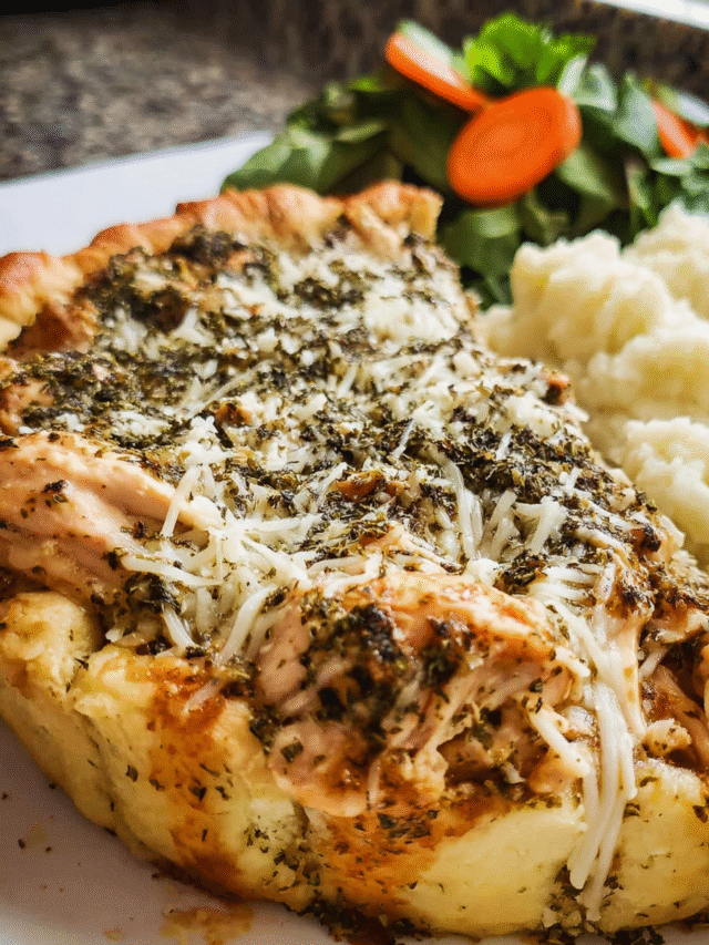Baked pesto ranch chicken freezer meal with golden crust in pie plate