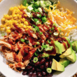 BBQ Chicken Burrito Bowl with rice, beans, and toppings