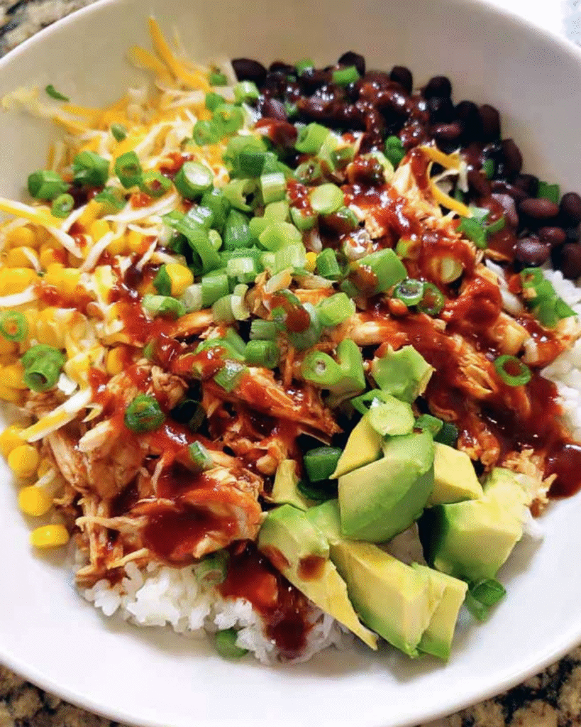 BBQ Chicken Burrito Bowl with rice, beans, and toppings