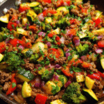 Beef and Vegetable Skillet with zucchini, broccoli, and bell peppers in a pan