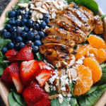 Chicken Spinach Salad with berries, feta, and balsamic dressing