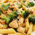 Chicken and Broccoli Pasta with lemon butter sauce in a white bowl