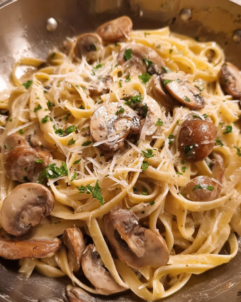 Creamy mushroom pasta with Parmesan and parsley in a skillet