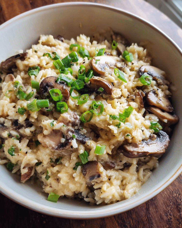 Creamy mushroom rice served in a bowl with green onions