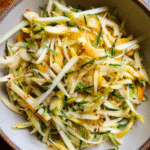 Crispy Apple Kohlrabi Salad with lemon zest and sunflower seeds