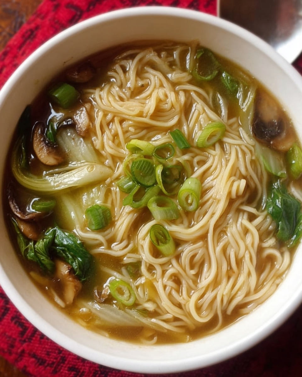 Quick noodle soup with bok choy and green onions in bowl
