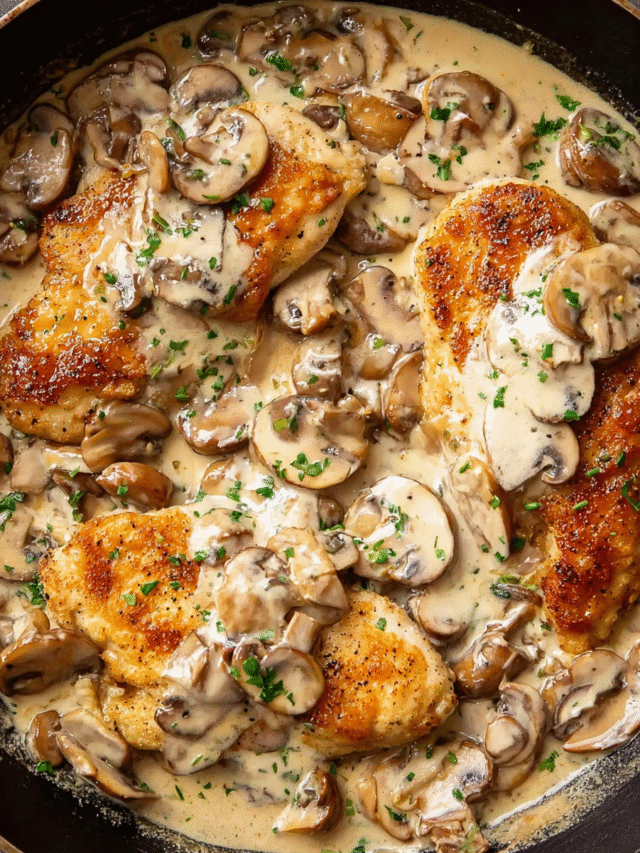 Chicken and Mushroom Cream Sauce served in skillet with herbs