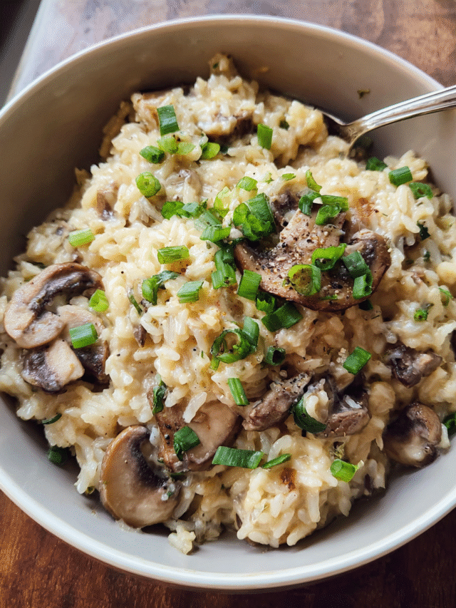 Creamy mushroom rice served in a bowl with green onions