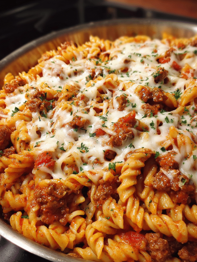 Easy skillet pasta with ground beef and melted mozzarella in a large pan