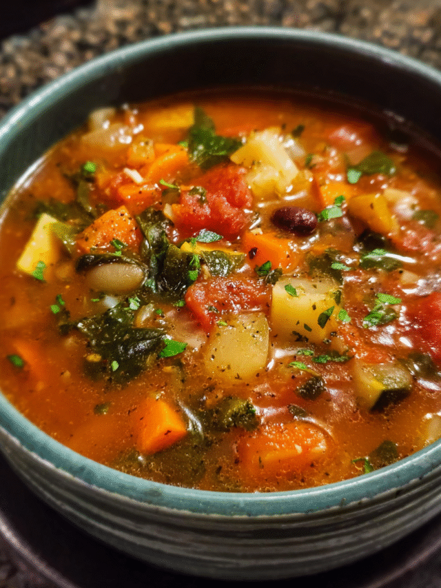 Easy weeknight soup with vegetables, beans, and broth in white bowl