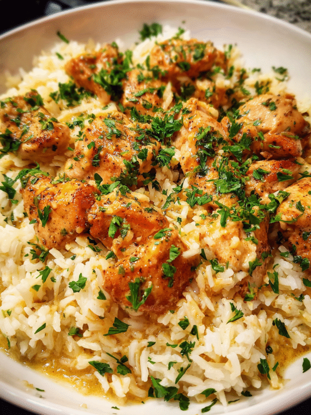 Garlic Butter Rice with Chicken served in a skillet with fresh parsley