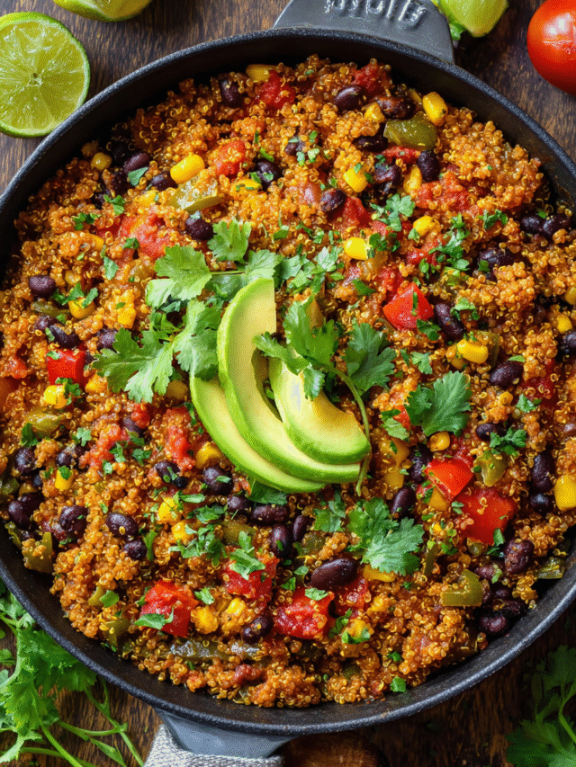 One pot quinoa bowl with black beans, corn, and avocado in a skillet