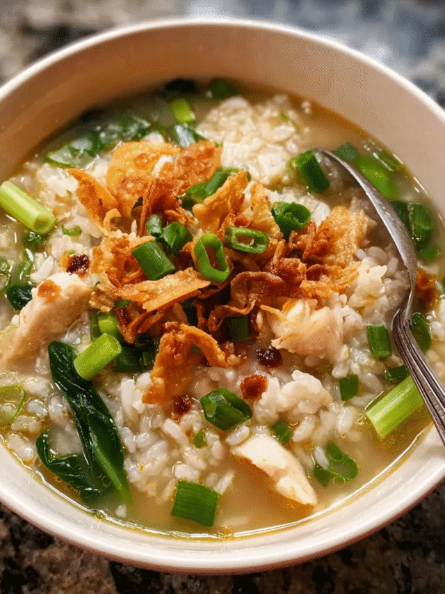 Bowl of Asian-style rice soup with fish and greens