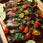 Cilantro lime flank steak sliced and topped with fresh tomato cilantro salsa