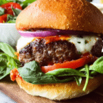 Easy grilled pizza burger with melted mozzarella and basil