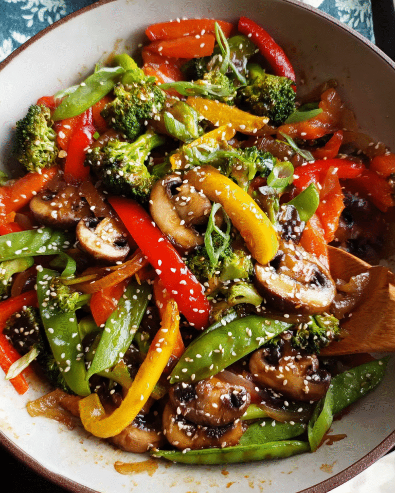 Easy veggie stir fry with broccoli, peppers, and sesame seeds in a skillet