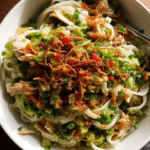 Green ginger rice noodles with shredded chicken and crispy onions