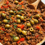 Stovetop picadillo served over rice with olives and cilantro