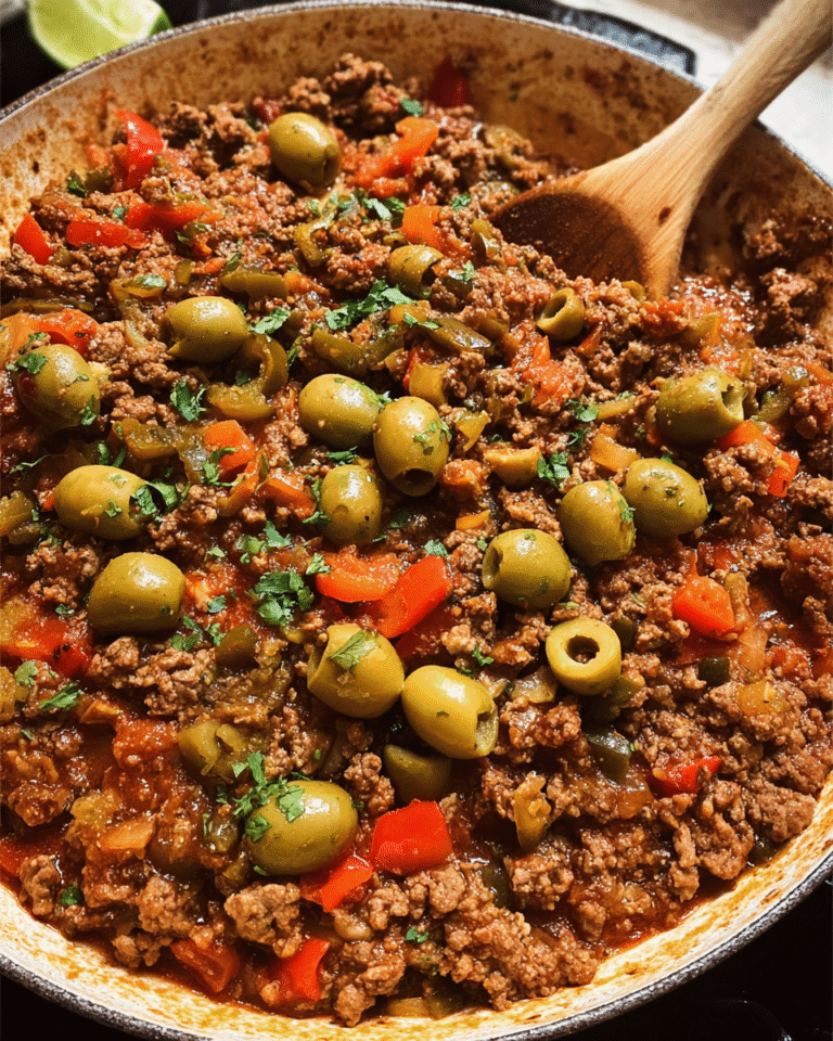 Stovetop picadillo served over rice with olives and cilantro